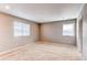 Neutral bedroom with two bright windows and neutral carpeting at 27615 E Archer Ave, Aurora, CO 80018