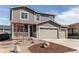 Charming two-story home featuring a three-car garage, well-maintained yard and welcoming front porch at 27615 E Archer Ave, Aurora, CO 80018
