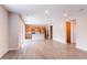Spacious open concept living area featuring kitchen with stainless steel appliances, granite island and living space at 27615 E Archer Ave, Aurora, CO 80018