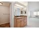 Bathroom features granite vanity, wood cabinets and shower at 14390 E Marina Dr # 510, Aurora, CO 80014