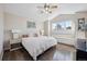 Bedroom with hardwood floors, vaulted ceiling and built in window bench seating at 3035 S Indiana St, Lakewood, CO 80228