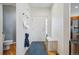 Bright entryway with hardwood floors and a convenient bench at 3035 S Indiana St, Lakewood, CO 80228