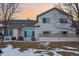 Exterior view of backyard showing patio and well-maintained siding at 3035 S Indiana St, Lakewood, CO 80228