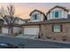 Townhouse features a two-car garage and brick accents at 3035 S Indiana St, Lakewood, CO 80228
