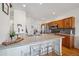 Bright kitchen featuring stainless steel appliances, granite countertops, and eat in island at 3035 S Indiana St, Lakewood, CO 80228