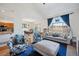 Open-concept living room boasts high ceilings, large windows, and stylish furnishings at 3035 S Indiana St, Lakewood, CO 80228