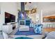 Bright living room features a vaulted ceiling, fireplace, and modern decor at 3035 S Indiana St, Lakewood, CO 80228
