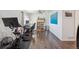 Office featuring a peloton, desk and bookshelf with hardwood floors at 3035 S Indiana St, Lakewood, CO 80228