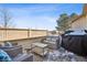 Cozy patio seating area with grill, perfect for outdoor entertaining and relaxation at 3035 S Indiana St, Lakewood, CO 80228