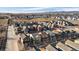Aerial view of a residential community showcasing the layout and nearby vacant land at 1143 Hummingbird Cir, Longmont, CO 80501