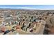 Beautiful aerial view of a neighborhood with colorful houses and mountains in the background at 1143 Hummingbird Cir, Longmont, CO 80501