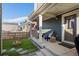 Cozy back porch with string lights and seating area, perfect for outdoor relaxation at 1143 Hummingbird Cir, Longmont, CO 80501