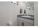 Half bathroom with a modern vanity, sleek fixtures, and clean, minimalist design at 1143 Hummingbird Cir, Longmont, CO 80501