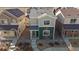 Street-level view of a well-maintained two-story home with a cozy front yard and charming curb appeal at 1143 Hummingbird Cir, Longmont, CO 80501