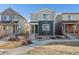 Charming two-story home with a well-maintained yard and inviting walkway to the front door at 1143 Hummingbird Cir, Longmont, CO 80501