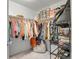 Walk-in closet offers ample storage space with shelving and hanging racks for optimal organization at 12685 E 104Th Pl, Commerce City, CO 80022