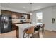 Modern kitchen with a large island, stainless steel appliances, and stylish countertops at 12685 E 104Th Pl, Commerce City, CO 80022