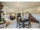 Finished basement area featuring a dining table, fireplace and lounge seating, with a neutral color palette at 17275 Gwilym Ct, Monument, CO 80132