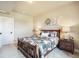 Charming bedroom with bedside tables, decorative wreath, and neutral decor at 17275 Gwilym Ct, Monument, CO 80132