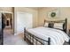Comfortable bedroom with a full bed, sliding closet door, and decorative wreath at 17275 Gwilym Ct, Monument, CO 80132