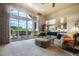 Comfortable living room featuring a sectional sofa, sliding glass doors to an outdoor patio, and an open-concept design at 17275 Gwilym Ct, Monument, CO 80132