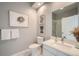 Clean bathroom with a walk-in shower, white tile, and modern vanity at 277 N Broadway # 208, Denver, CO 80203