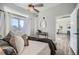 Main bedroom with a queen bed and view into the living room at 277 N Broadway # 208, Denver, CO 80203