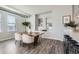 Modern dining area featuring a wooden table and plush seating at 277 N Broadway # 208, Denver, CO 80203
