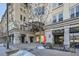 Building entrance with inviting storefronts and landscaping at 277 N Broadway # 208, Denver, CO 80203