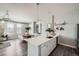 Open kitchen with white cabinets, stainless steel appliances, and an island at 277 N Broadway # 208, Denver, CO 80203