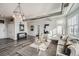 Sunlit living room with hardwood floors and comfortable seating at 277 N Broadway # 208, Denver, CO 80203