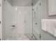 Spacious walk-in shower with glass enclosure and marble flooring at 277 N Broadway # 208, Denver, CO 80203