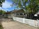 Charming single-story home with a well-maintained yard and a classic white picket fence at 437 6Th St, Frederick, CO 80530