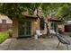 Cozy back house featuring green french doors and windows, accompanied by outdoor seating at 235 Eudora St, Denver, CO 80220