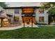 Expansive backyard features an outdoor kitchen and a pergola covered patio at 235 Eudora St, Denver, CO 80220