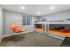 Fun bedroom with bunk beds and a hanging chair with a pink pillow and a small window at 235 Eudora St, Denver, CO 80220