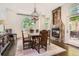 Charming dining room with a fireplace, chandelier, and large windows at 235 Eudora St, Denver, CO 80220