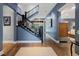 Inviting foyer featuring hardwood floors, staircase, and views to the outside at 235 Eudora St, Denver, CO 80220