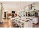 Gourmet kitchen and great room featuring a large island, stainless steel appliances, and breakfast bar at 235 Eudora St, Denver, CO 80220