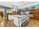 Gourmet kitchen features stainless steel appliances, double islands, and custom cabinetry at 235 Eudora St, Denver, CO 80220