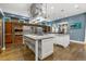 Spacious kitchen boasts a large center island, stainless steel appliances, and ample storage at 235 Eudora St, Denver, CO 80220