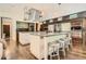 Expansive kitchen boasts stainless steel appliances, a large island, and modern lighting at 235 Eudora St, Denver, CO 80220