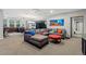 Comfortable living room featuring plush seating, a wet bar, and a billiards table for entertainment at 235 Eudora St, Denver, CO 80220