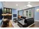 Cozy living room with a fireplace, custom built-ins, and recessed lighting at 235 Eudora St, Denver, CO 80220