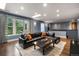 Comfortable living room with skylights, hardwood floors, and large windows at 235 Eudora St, Denver, CO 80220