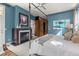 Spacious main bedroom with a fireplace, four-poster bed, and large windows at 235 Eudora St, Denver, CO 80220