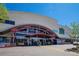 A Whole Foods Market entrance featuring a red awning and many windows at 235 Eudora St, Denver, CO 80220