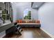Sitting area with a bench seat, decorative pillows, and large window at 235 Eudora St, Denver, CO 80220