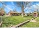 Large grassy backyard with patio area, garden bed and shed at 4108 S Inca St, Englewood, CO 80110