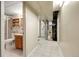 Hallway view showcasing a basement bathroom with a shower and single sink vanity at 4108 S Inca St, Englewood, CO 80110